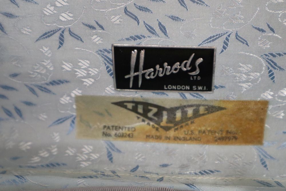 A Harrods suitcase containing 1900-40s cream chiffon and silk blouses, etc and a petit point bag
